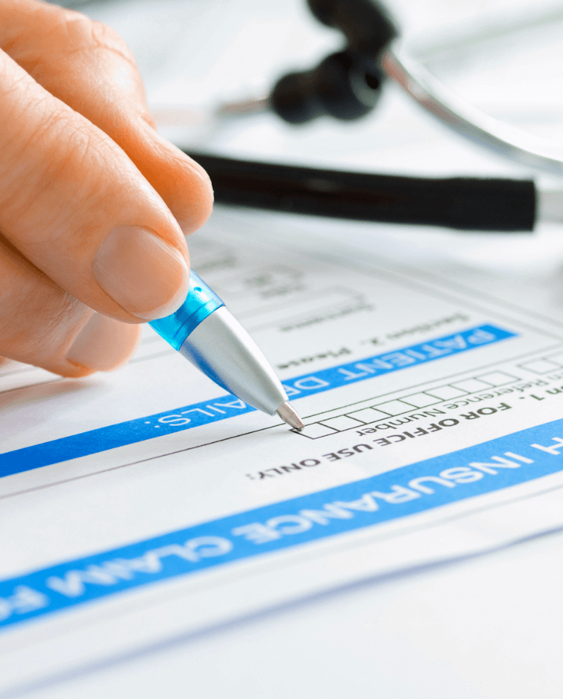 Medical provider filling out health insurance form