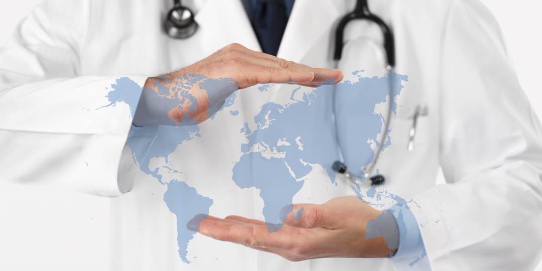 medical provider holding up his hand to a graphic of the world 