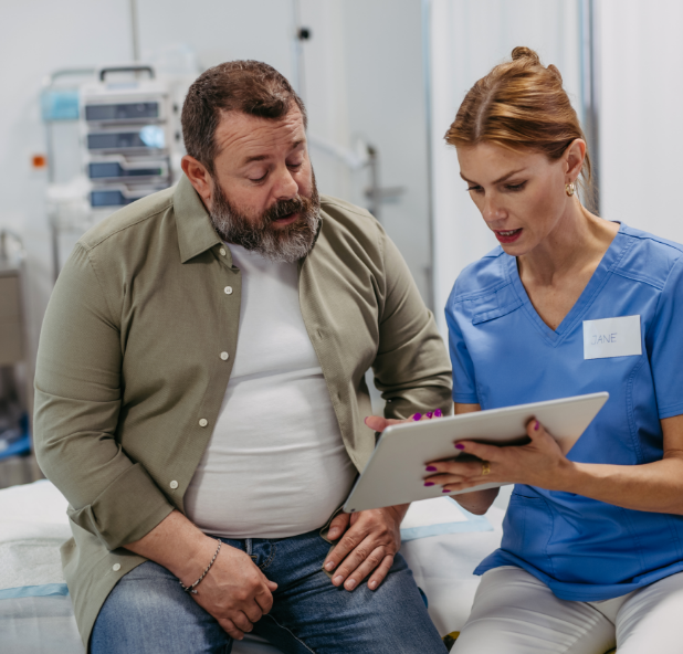 overweight man speaking with a doctor