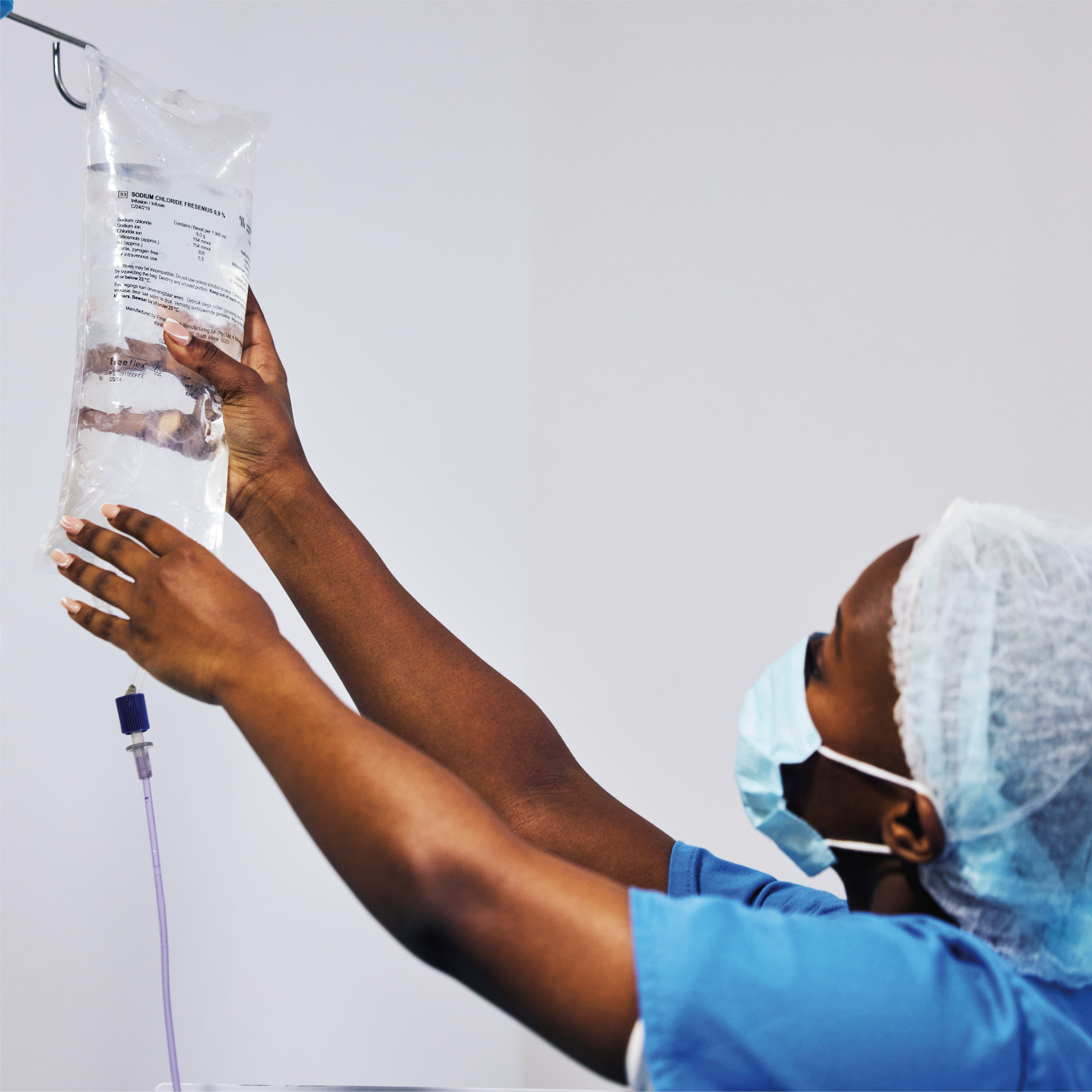 doctor setting up an IV drip