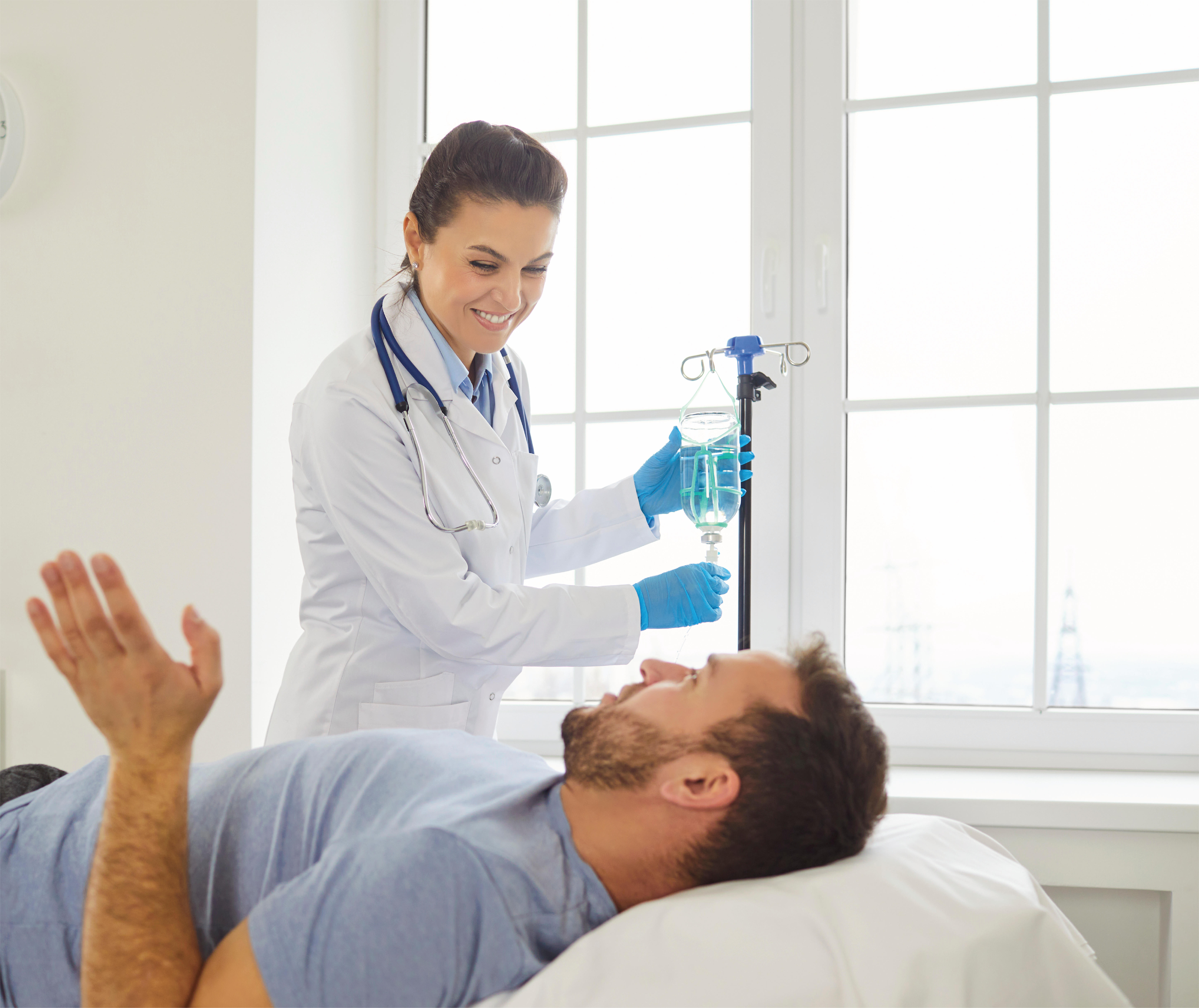 doctor with a patient that's receiving a hydration IV drip 