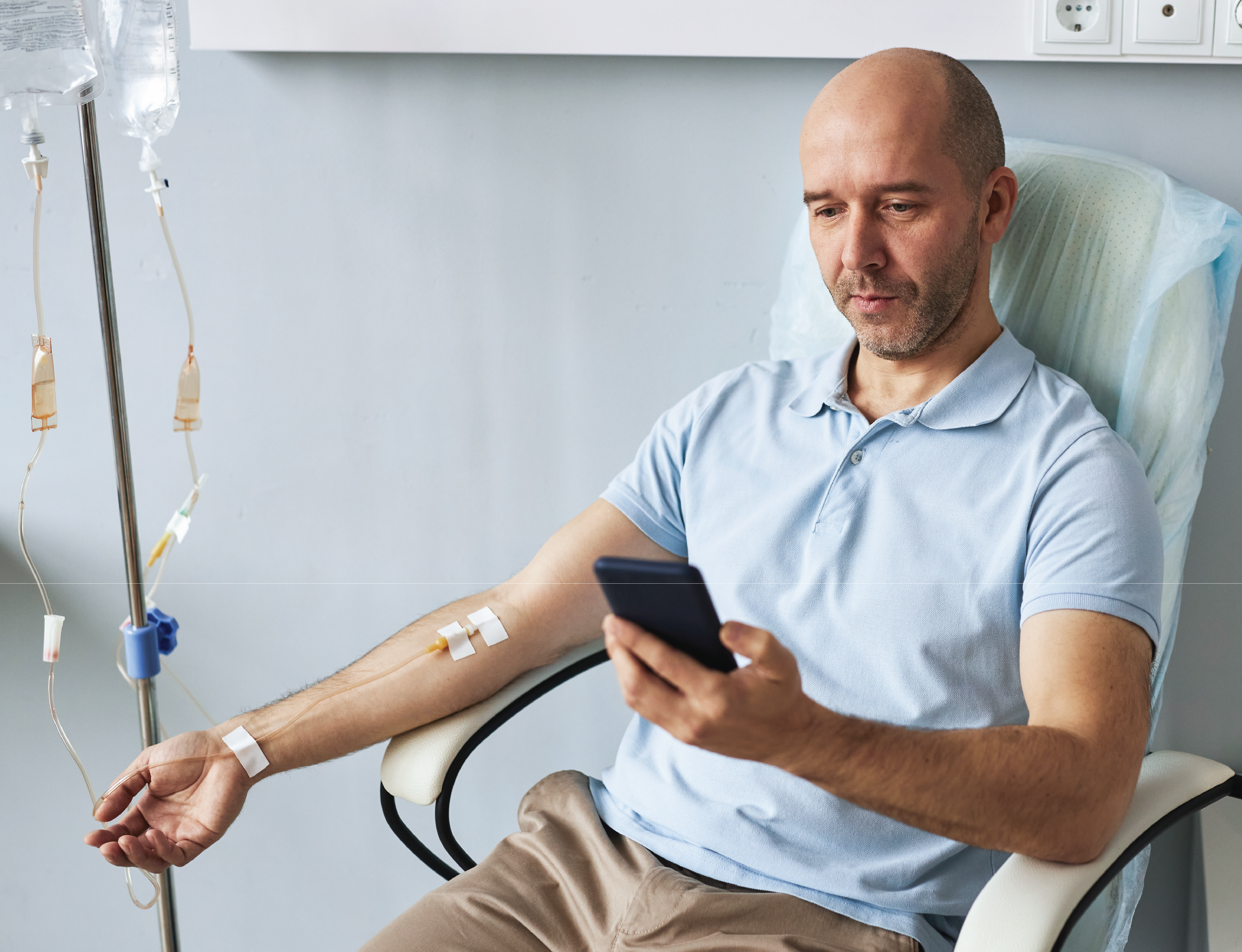 man receiving an IV drip