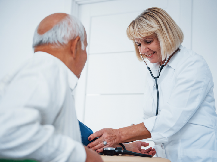 doctor performing a physical exam on a patient 
